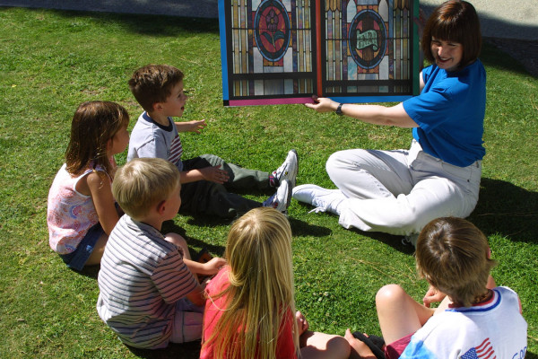 Teacher telling Bible story to kids