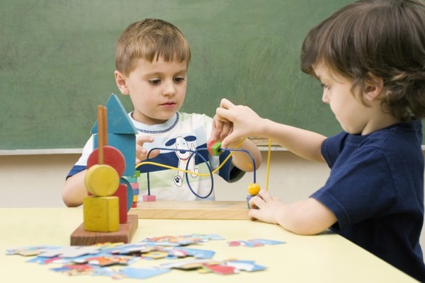 Young boys play wire game