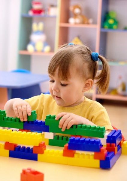 Young girl playing with blocks